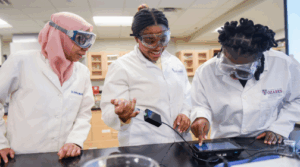 Students working with Dr. Murdianti in a chemistry lab