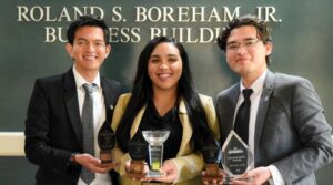 Students receiving an award for business/entrepreneurship competition
