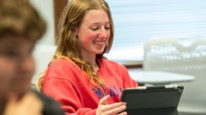 Student studying in class on iPad