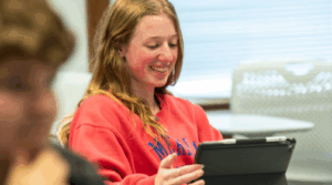 Student studying in class on iPad