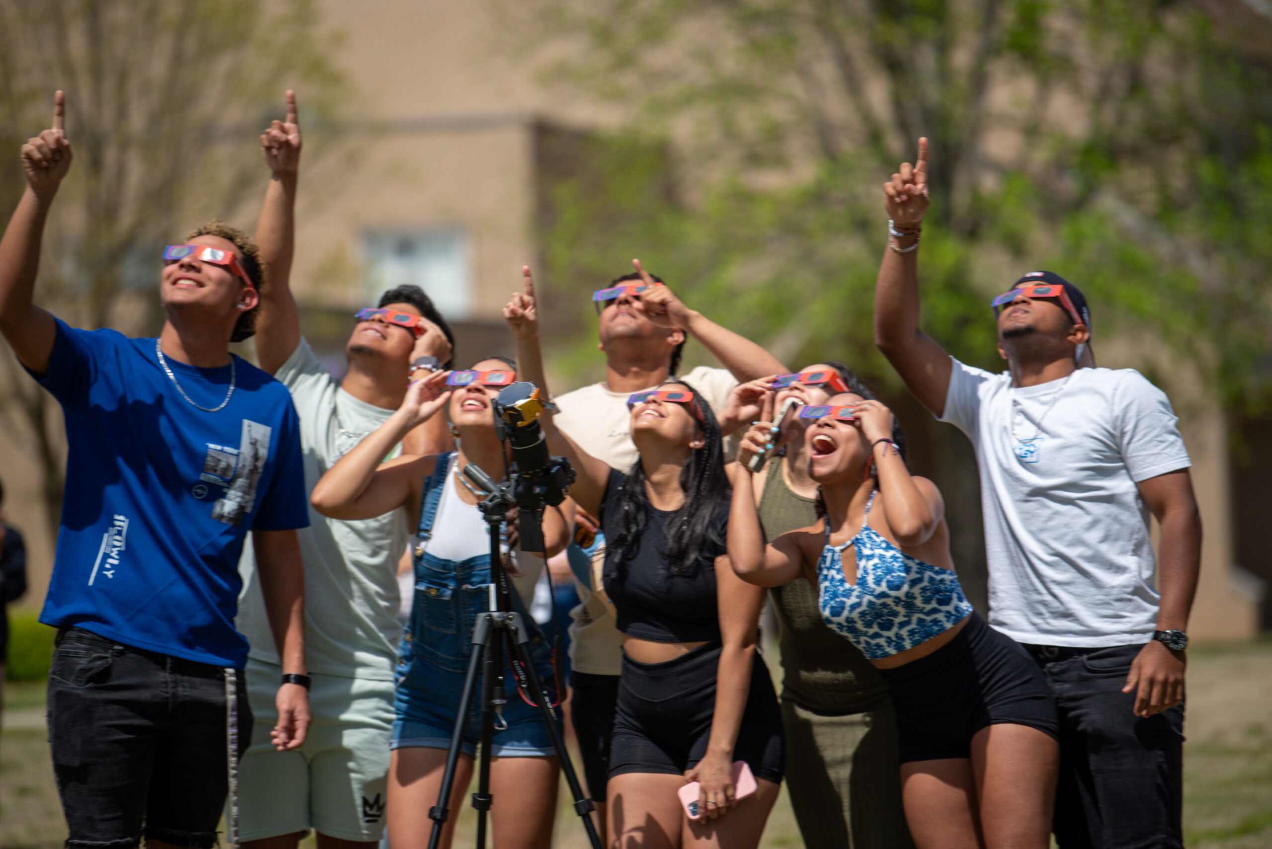group of students watching eclipse