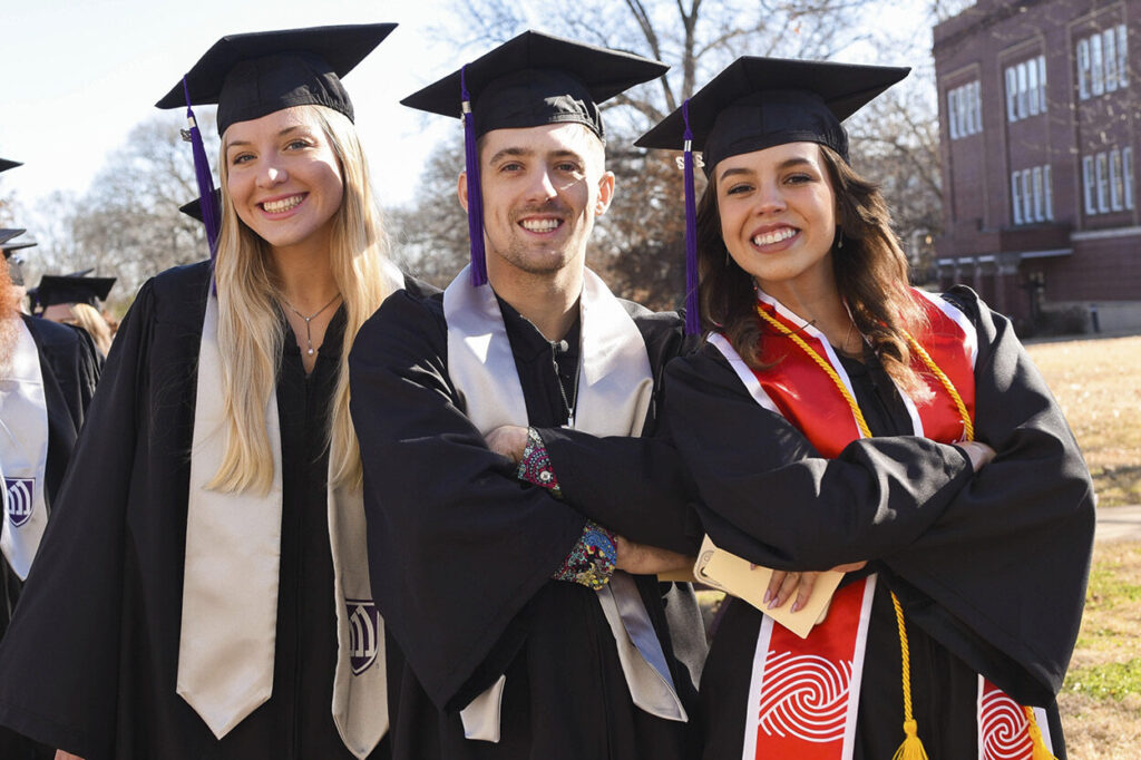 Graduates pose before ceremony