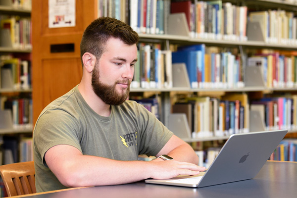 Student on MacBook Neo