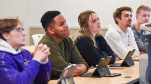 Ozarks students listen to a business lecture in the Boreham business building