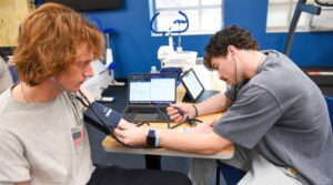 Students studying heart rate in health science class