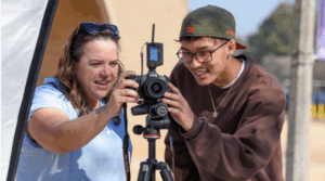 Professor Duvall and student working together on outdoor photography project